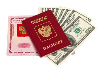Russian passport and US dollars over white