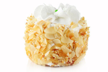 Cake with peanut butter chips and cream on a white background.