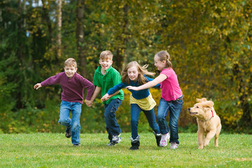 Fototapeta premium Group of kids running outside