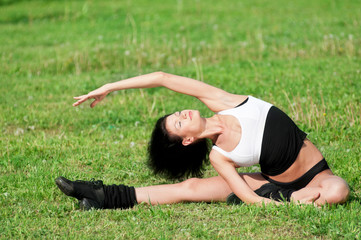 Fototapeta premium Woman doing stretching exercise. Yoga