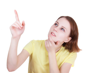 Fototapeta premium Young woman pointing to the top side
