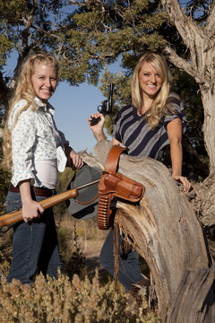 two women with guns