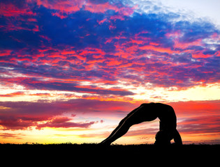 Yoga silhouette at sunset