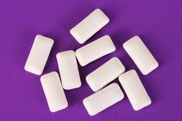 Chewing gums on purple background