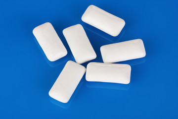 Chewing gums on blue background