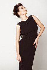 Naklejka premium Beautiful woman in a black dress