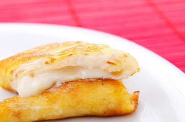 Custard filled pancake in plate