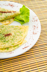 Pancake with herbs in the plate