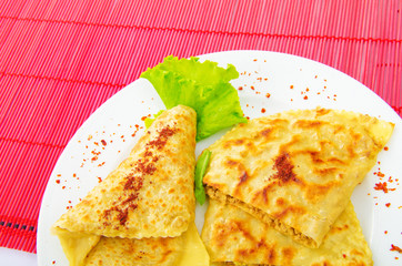 Pancake with herbs in the plate
