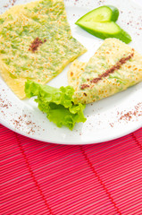 Pancake with herbs in the plate