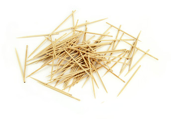 Many chaotic scattered toothpicks, isolated on white