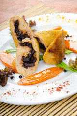 Meat and vegetable roll in plate