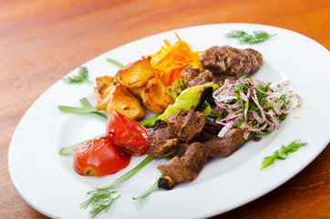 Plate with tasty lamp kebabs