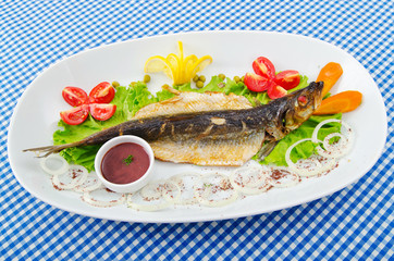 Fried fish in the plate