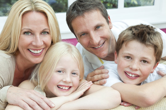 Happy Family Having Fun Sitting At Home