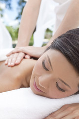 Obraz na płótnie Canvas Woman Relaxing At Health Spa Having Outdoor Massage
