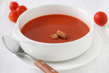tomato soup in white bowl