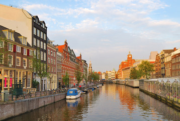 Fototapeta na wymiar Amsterdam. Golden sunset on Singel