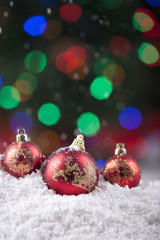 Christmas balls with snow and colorful lights