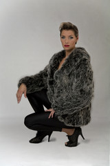 Pretty woman with real fur jacket
