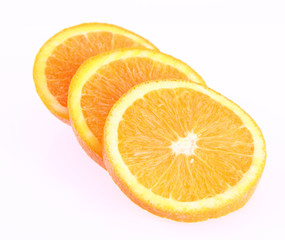 Half an Orange cut into slices on a white background