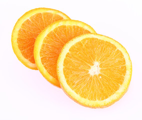 Half an Orange cut into slices on a white background