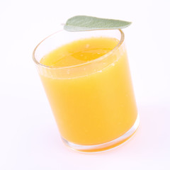 Orange juice, a glass decorated with salvia