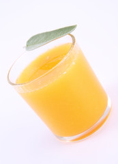 Orange juice, a glass decorated with salvia