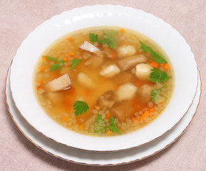 Hot mashroom soup on a served table
