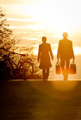 silhouette of couple walking in sunset light
