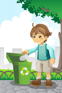 Boy recycling paper