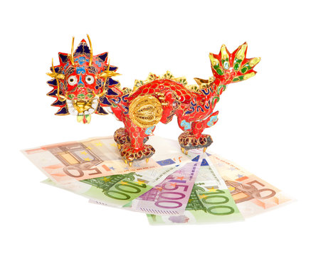 Traditional Chinese red dragon on euro banknotes isolated