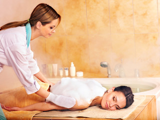 Massage of woman in beauty spa.