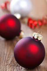 christmas baubles on wooden board