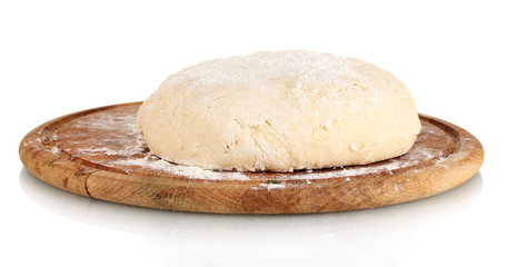 Dough on wooden board isolated on white