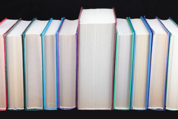 Books of different colours  isolated.