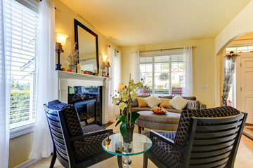 Luxury elegant luvung room in yellow with fireplace