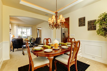 Yellow dining room with elegant setting