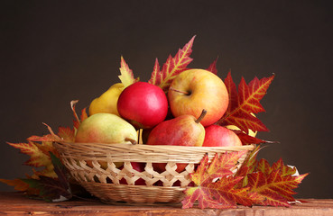 beautiful autumn harvest in basket and leaves