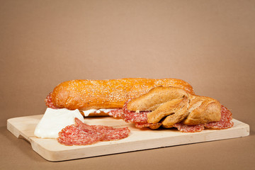 Sandwich wit italian salami and fresh cheese