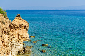 Transparent turquoise sea, sand rock