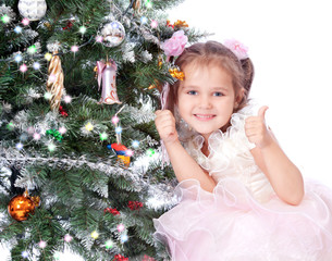 beautiful girl with a Christmas tree