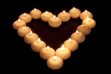 Heart of burning candles