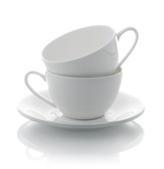 two white cup and saucer isolated on background