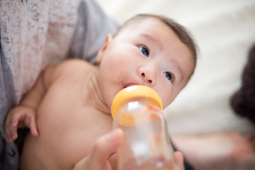 mother feed milk to baby