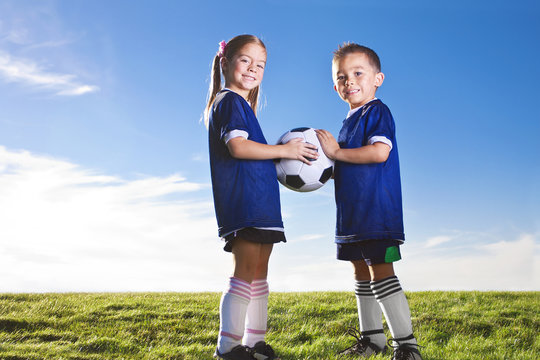 Youth Soccer players on a grass field