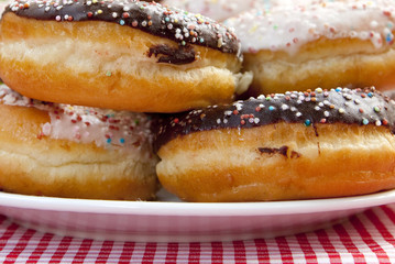 A couple of donuts on table.