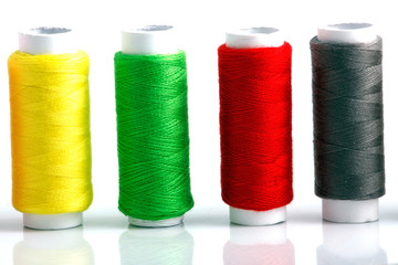 Set of colorful spools of thread