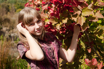 girl near the ashberry bush shrub