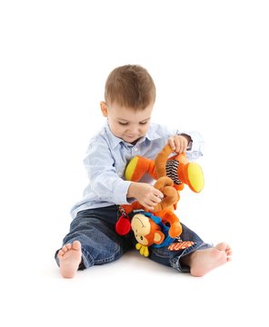 Cute toddler playing with toy